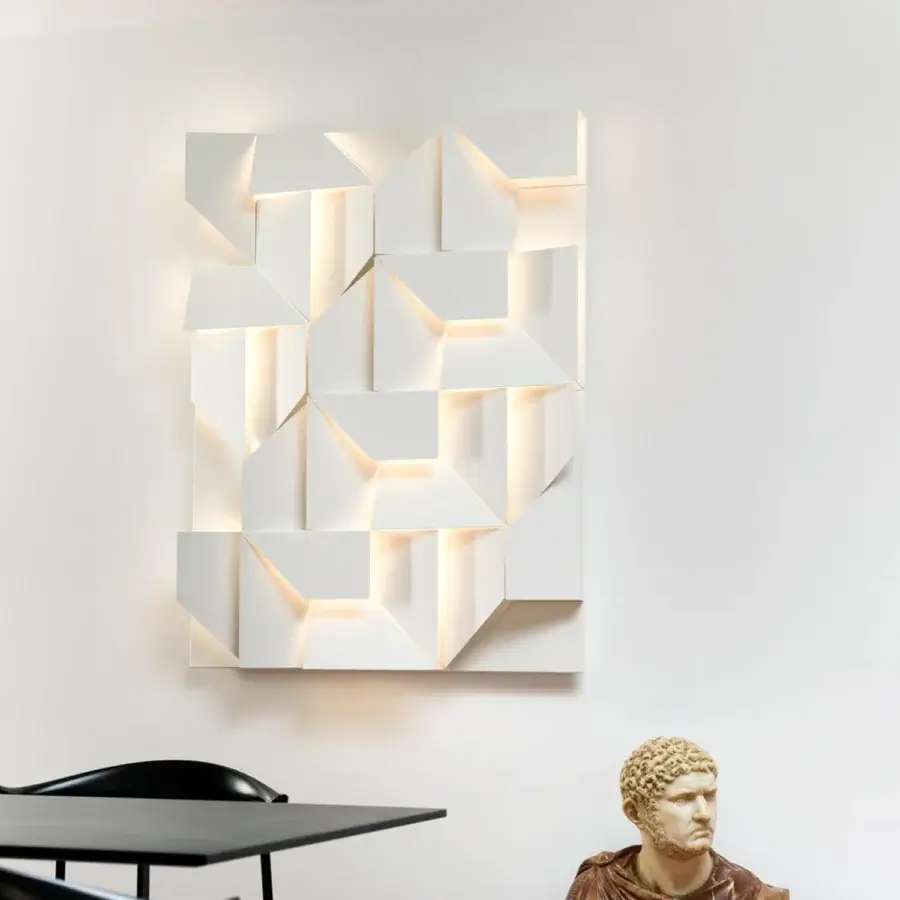 Architectural Nemo Lighting Wall Shadows wall lamp crafted with laser-cut aluminum in matte white with layered planes and compelling shadows