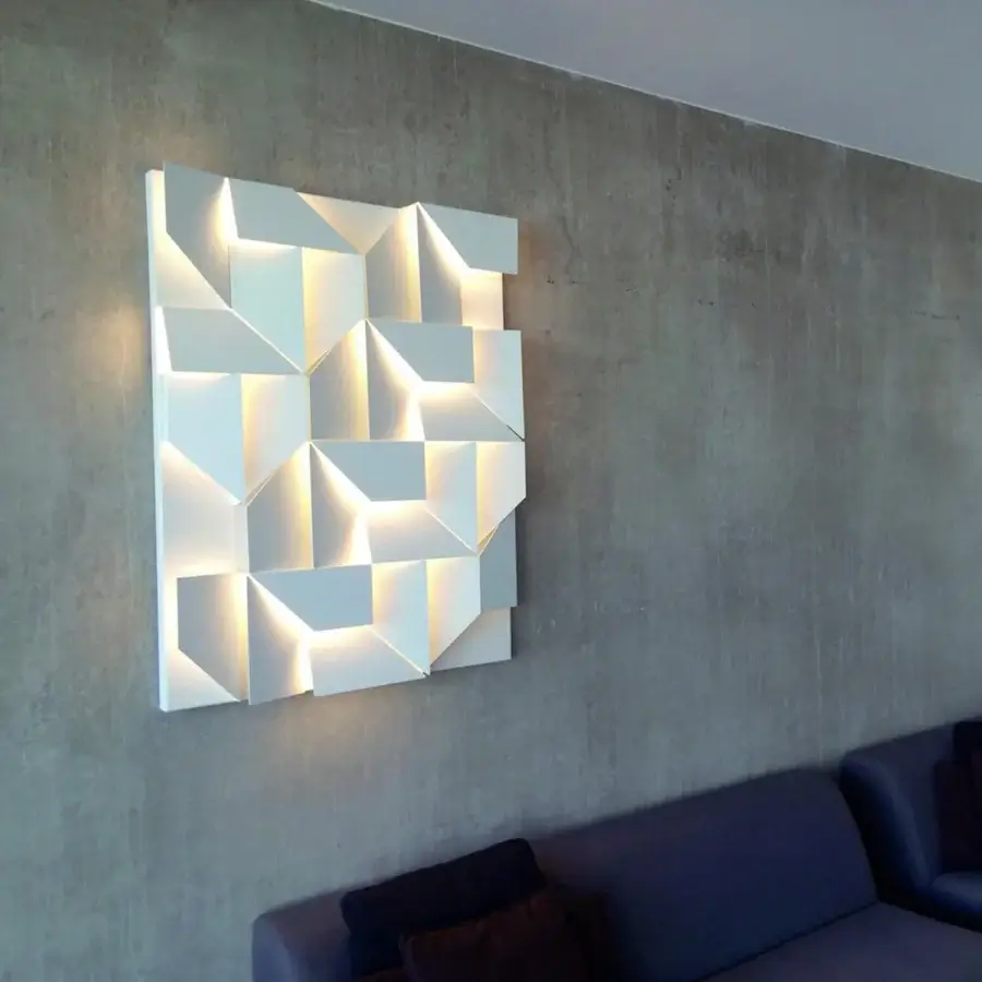 Captivating Nemo Lighting Wall Shadows wall lamp crafted with laser-cut aluminum and matte white painted finish casts compelling shadows