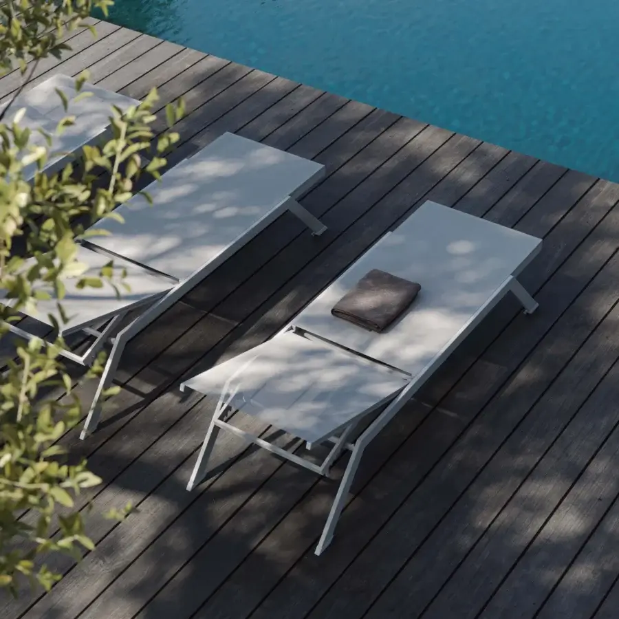 Refined MY YOUR Maja lounger with lightweight aluminum frame and crisp white textile surface embodies minimalist design