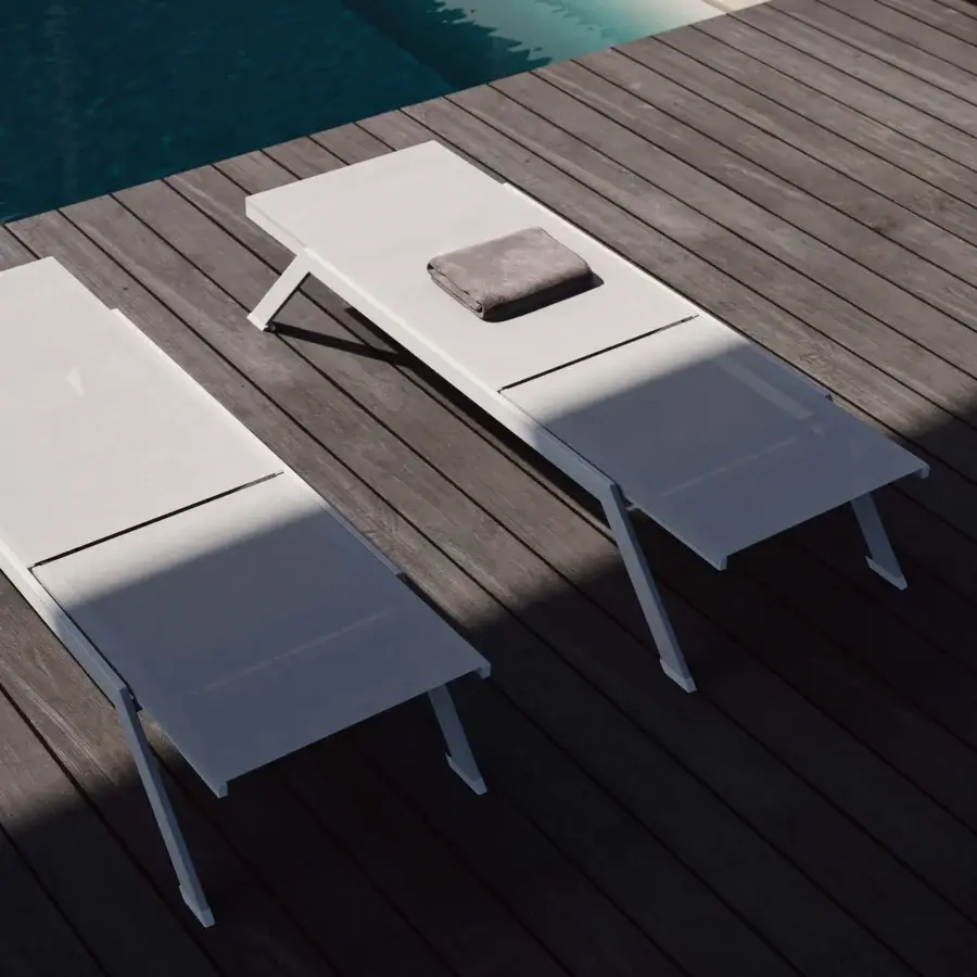 Distinguished MY YOUR Maja lounger crafted with a lightweight aluminum frame and pale gray subtly textured textile with matte finish