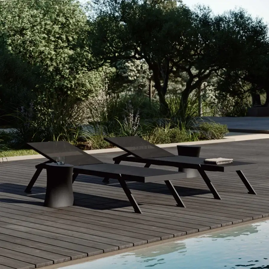 Sophisticated MY YOUR Maja lounger built with a durable synthetic material and lightweight aluminum frame in a dark gray finish