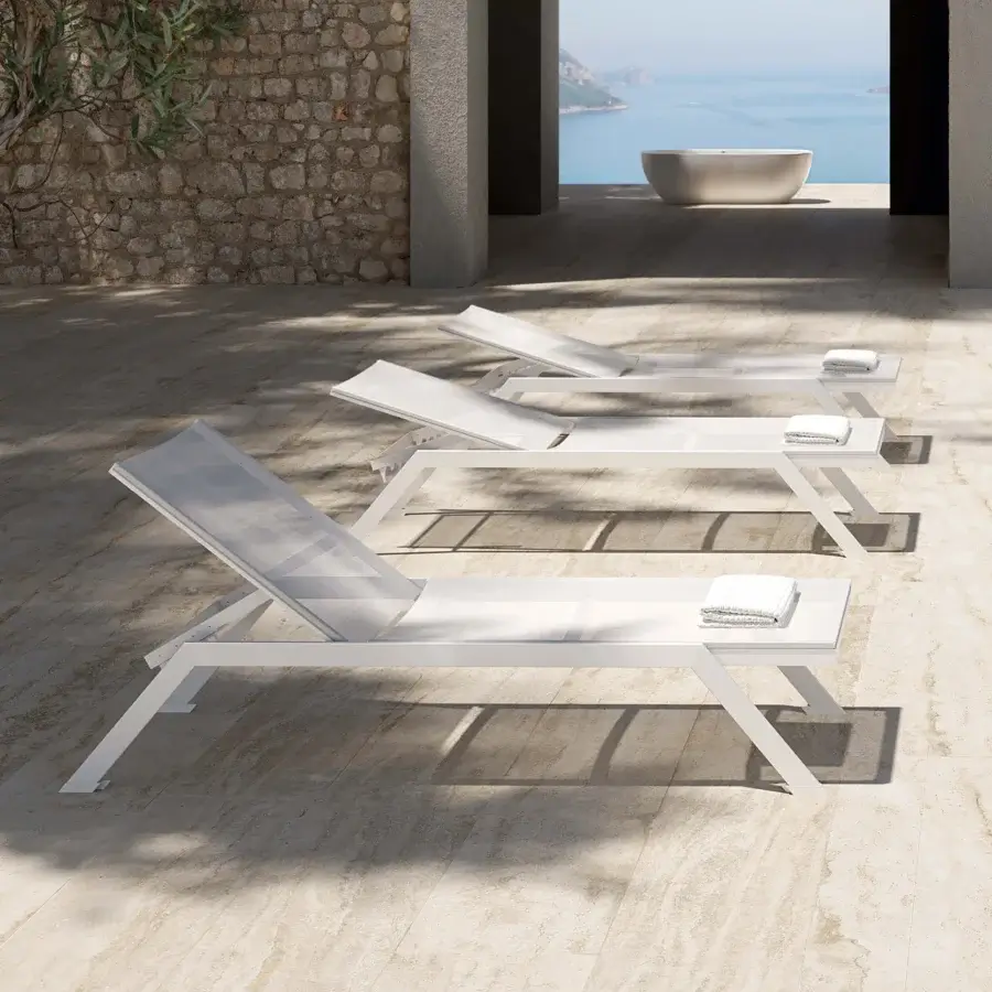 Refined MY YOUR Maja lounger crafted with lightweight aluminum and a smooth matte white finish