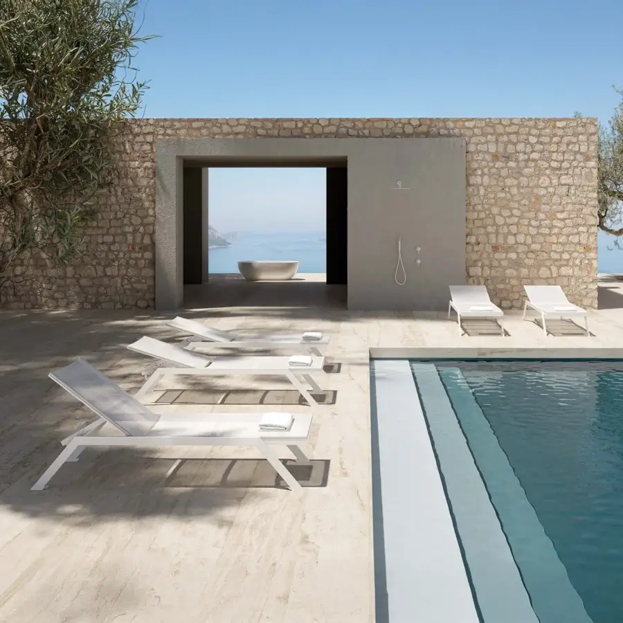 Distinguished MY YOUR Maja lounger crafted with woven textile and lightweight aluminum in a matte white finish