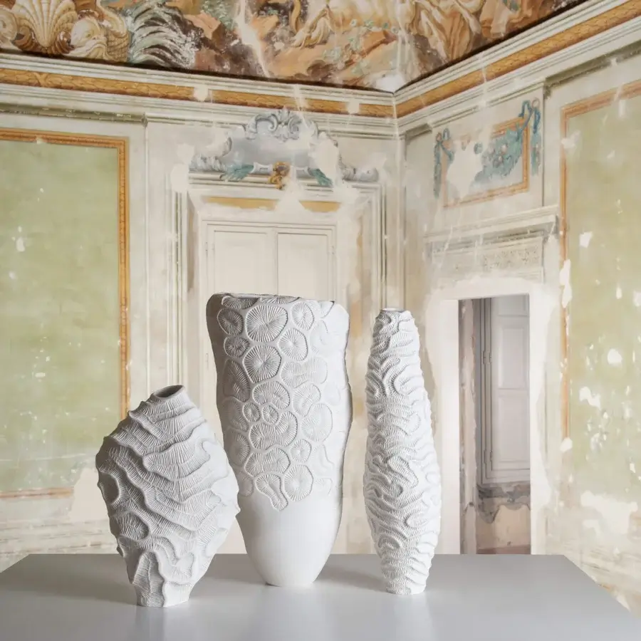 Distinguished FOS Ceramiche Menhir vase crafted in white biscuit porcelain with a textured, bulbous silhouette
