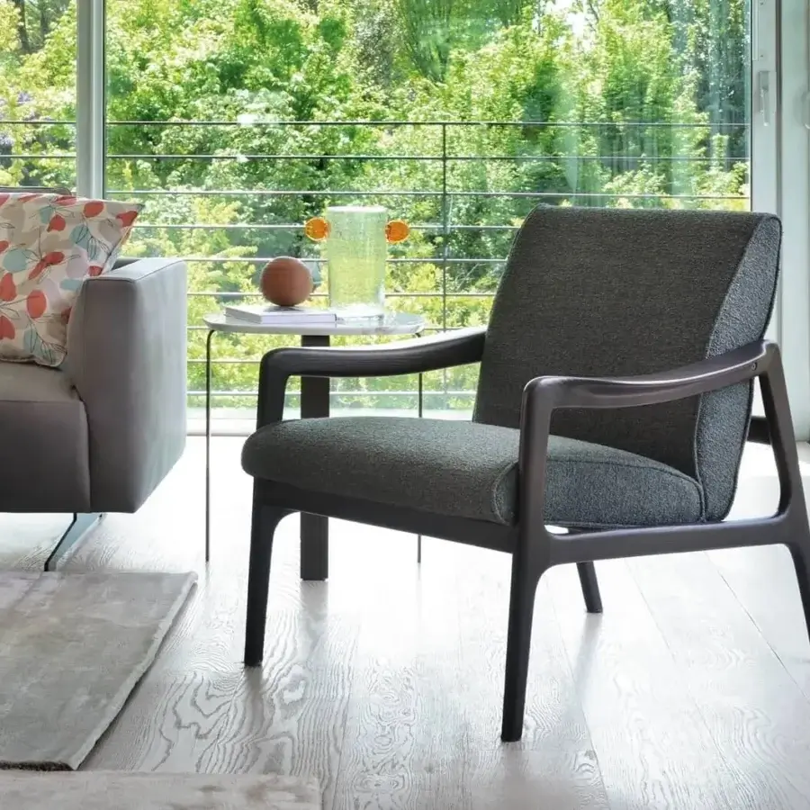 Exceptional CTS Salotti Jack lounge chair crafted with Canaletto walnut and dark matte finish in textured dark gray textile upholstery