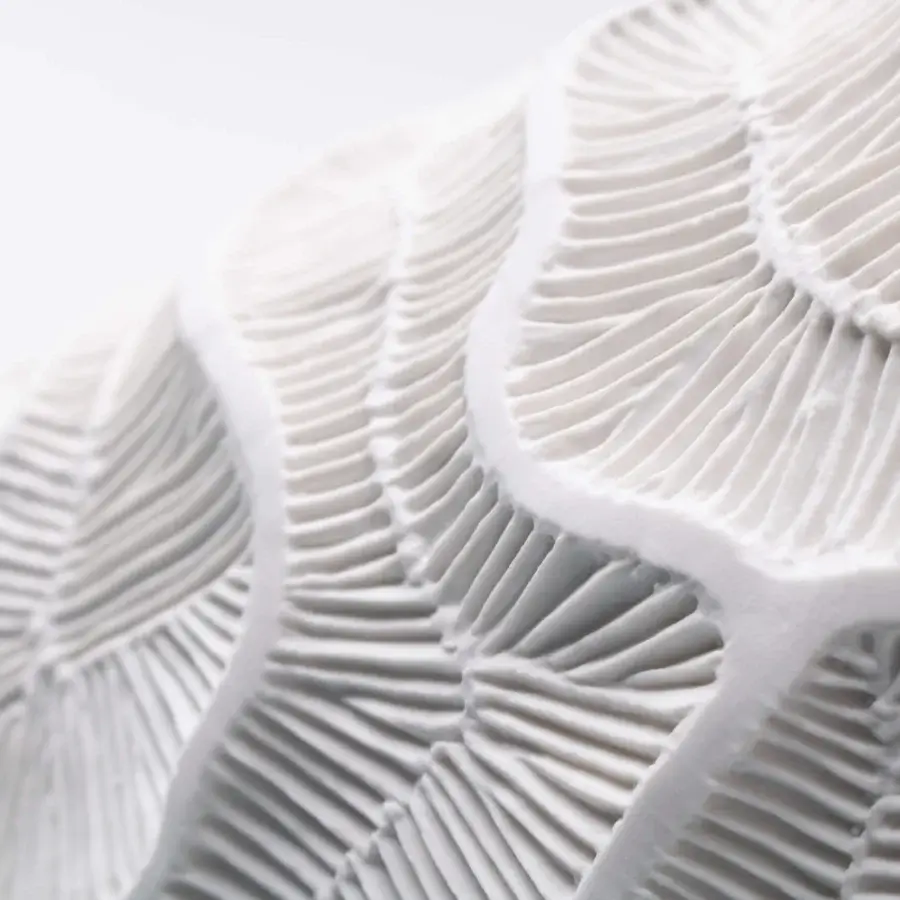 Superior FOS Ceramiche Monolite vase crafted in white biscuit porcelain with an undulating surface and matte finish