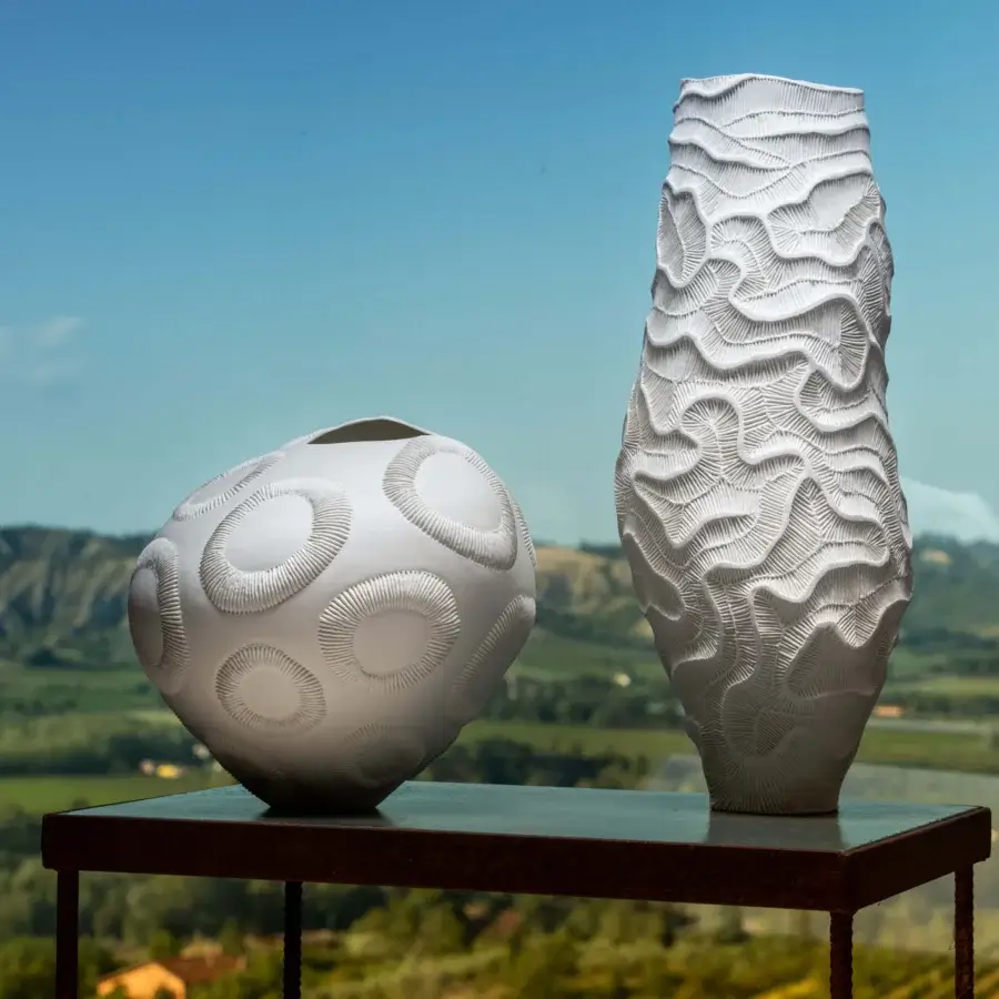 Elegant FOS Ceramiche Monolite vase crafted in white biscuit porcelain with a textured, undulating surface