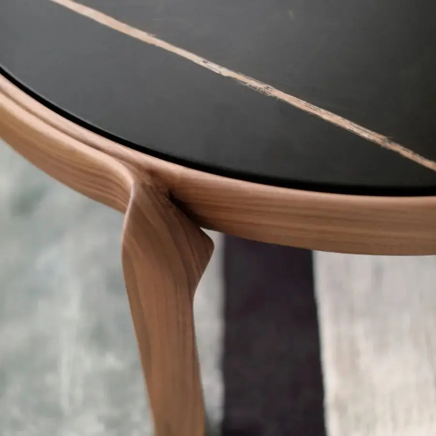 Distinguished CTS Salotti Tape coffee table crafted in warm brown solid wood with a satin finish and striking black marble tabletop