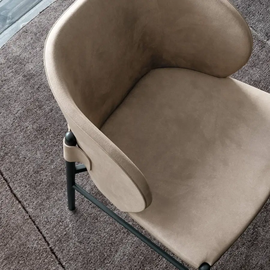 Distinguished Dallagnese Supernova chair upholstered in warm beige matte fabric with a dark metal frame and curved backrest