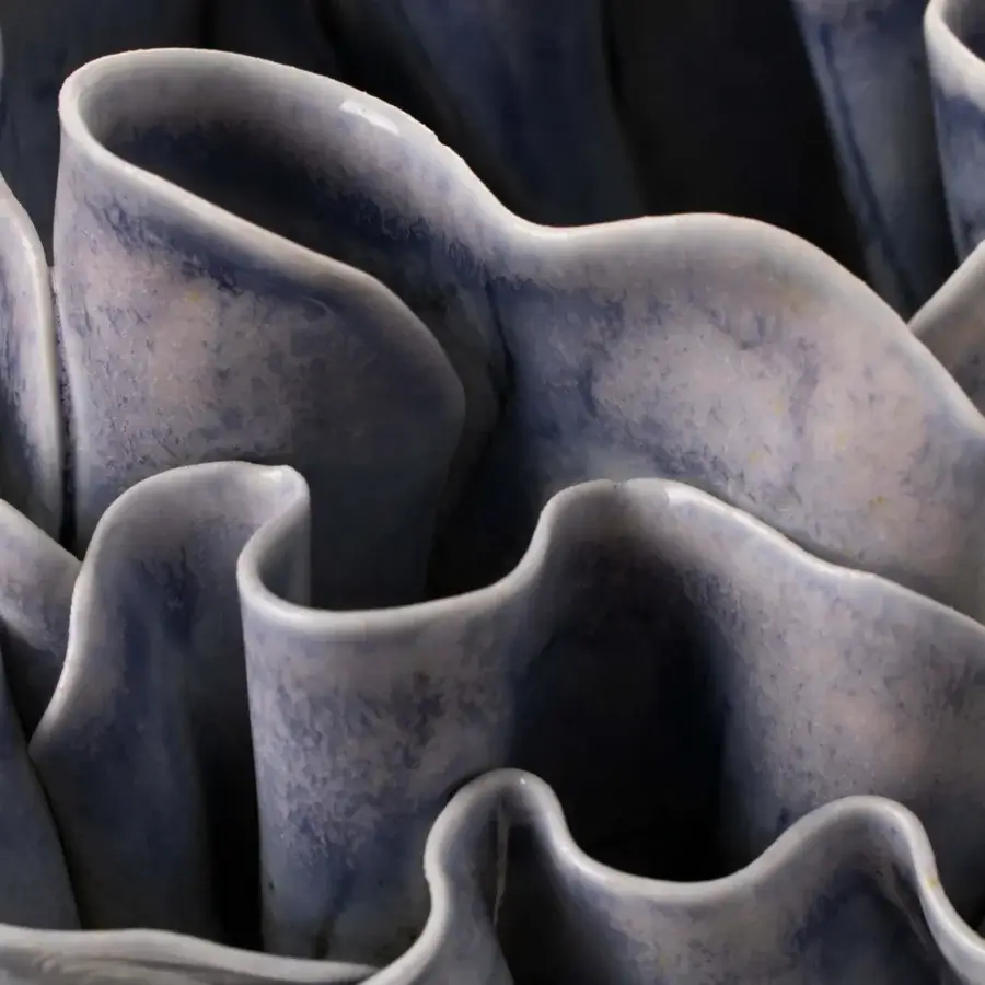 Distinguished FOS Ceramiche Antholia Blue vase crafted in white biscuit porcelain with a nuanced blue glaze and intricate madreporic textures