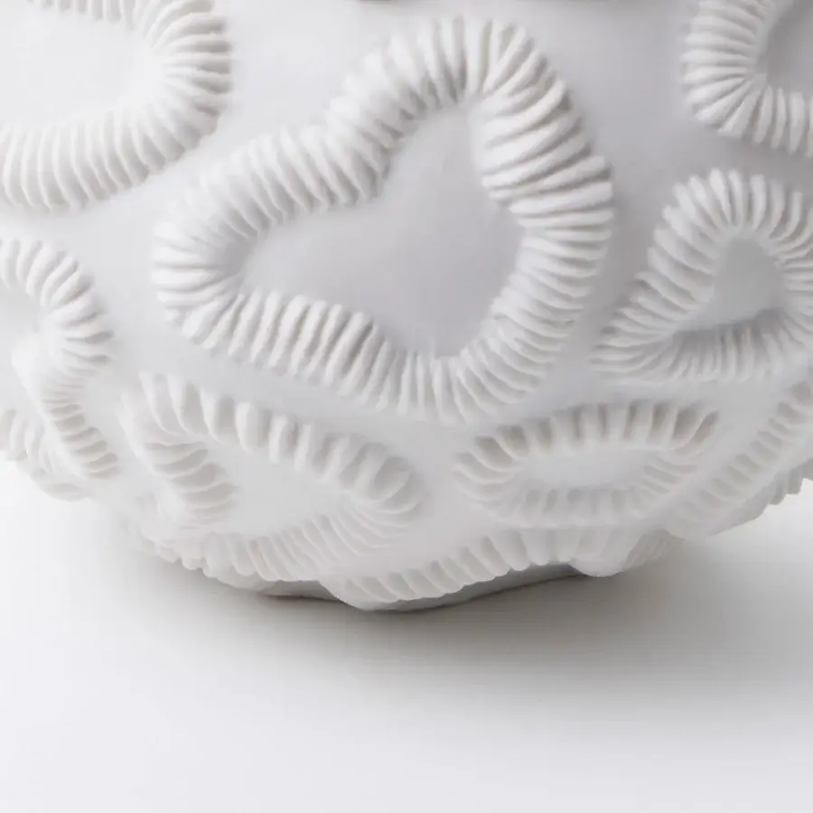 Distinguished FOS Ceramiche Antholia vase crafted in white biscuit porcelain with a textured madreporic exterior and matte finish