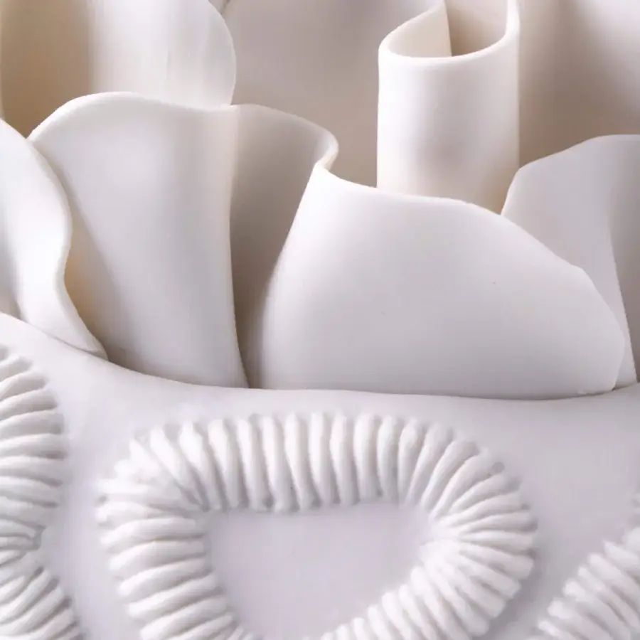 Elegant FOS Ceramiche Antholia vase crafted in white biscuit porcelain with a delicate madreporic texture and matte finish