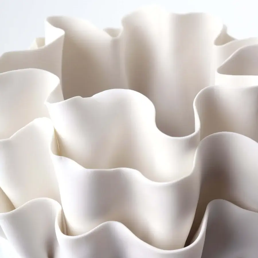 Distinguished FOS Ceramiche Fiordimar vase crafted in white biscuit porcelain with undulating layers and smooth matte finish