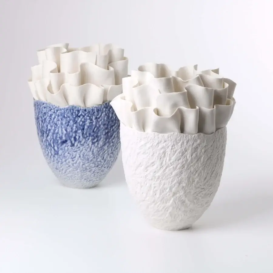 Exceptional FOS Ceramiche Fiordimar vase handcrafted in white biscuit porcelain with textured exterior and petal-like layers