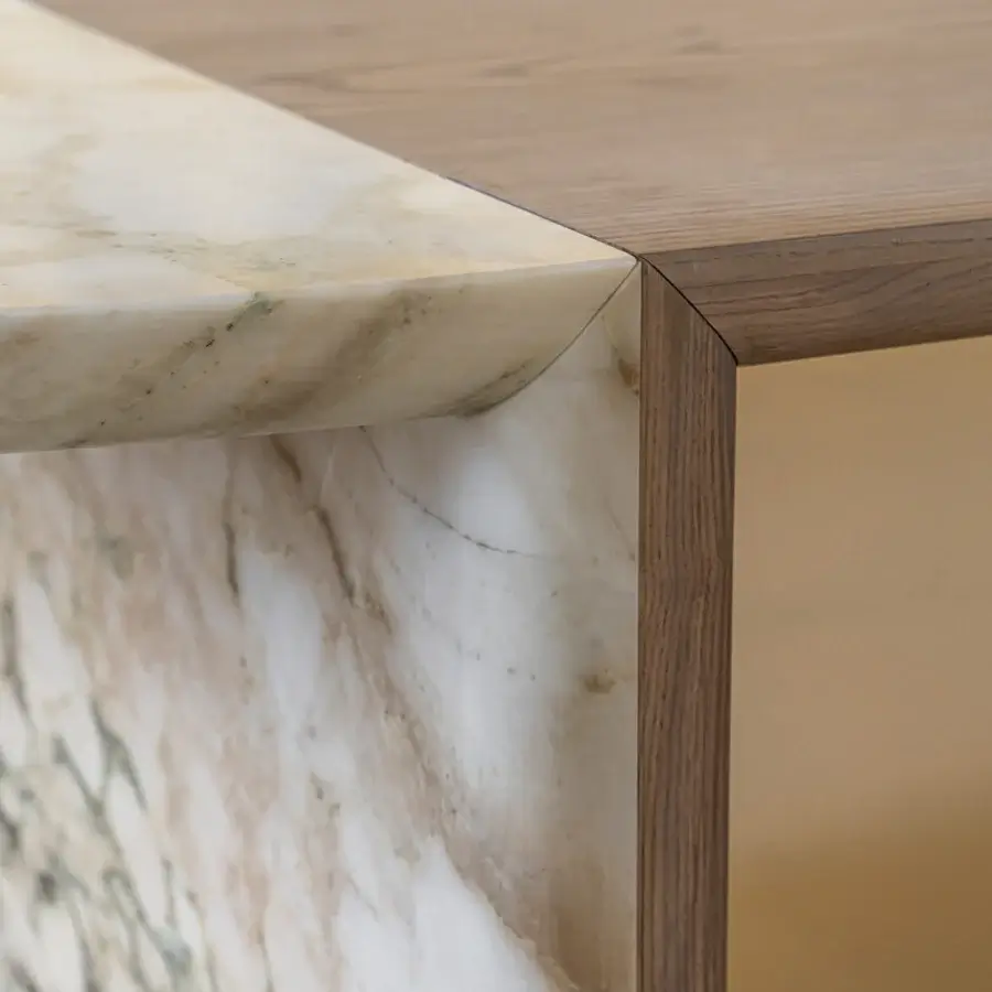 Exceptional Shake Mayfair table built with solid ash wood and honed Breccia Capraia marble in a unique oval silhouette