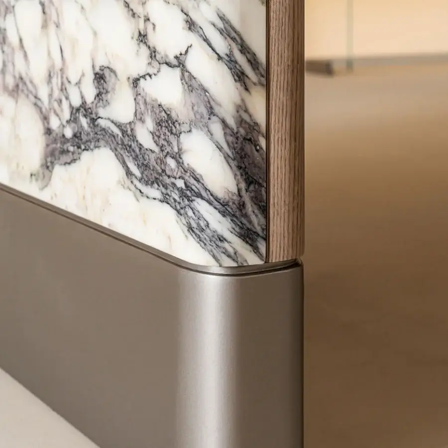 Superior Shake Mayfair table built with honed Breccia Capraia marble and solid ash wood showcasing a sculpted oval silhouette with a curved metal base