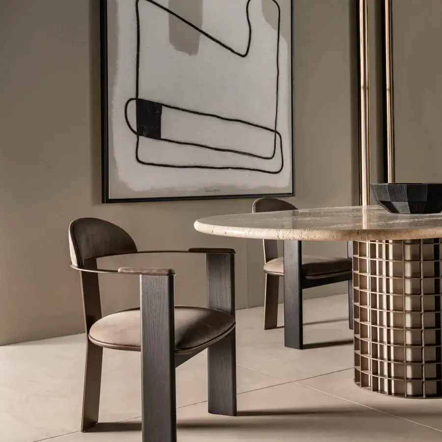 Distinguished Shake Vogue table with warm beige veined marble top and sleek varnished steel base crafted in Italy