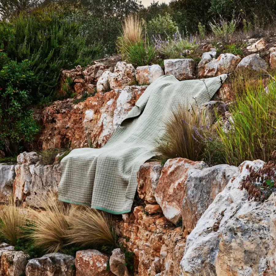 Distinguished MY YOUR Aladdin rug hand-sewn from rope in a light green and beige mottled pattern with a matte finish