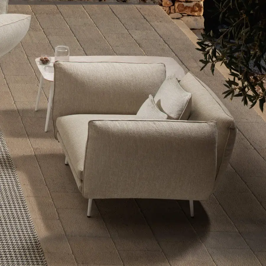 Exceptional MY YOUR Piuma lounge chair with aluminum structure and neutral beige outdoor fabric boasting highlighted stitching with a matte texture