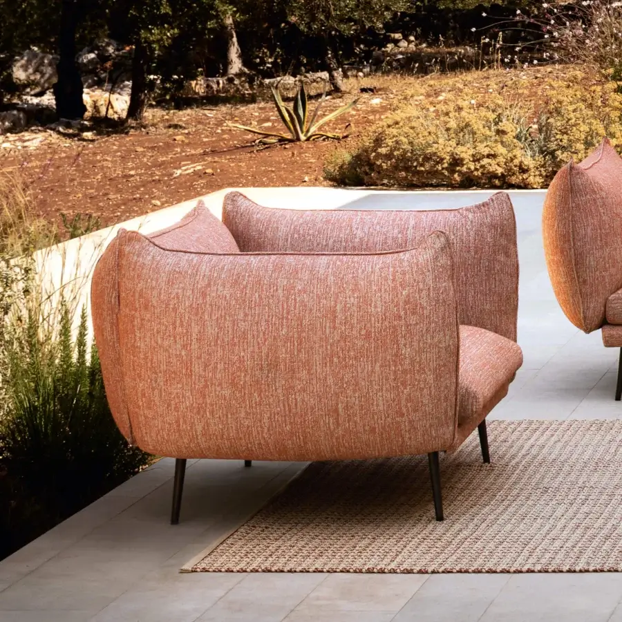 Lavish MY YOUR Piuma lounge chair with aluminum structure and terracotta outdoor fabric upholstery, showcasing highlighted stitching