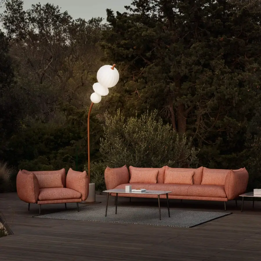 Distinguished MY YOUR Piuma lounge chair crafted with aluminum and durable outdoor fabric in a muted terracotta finish