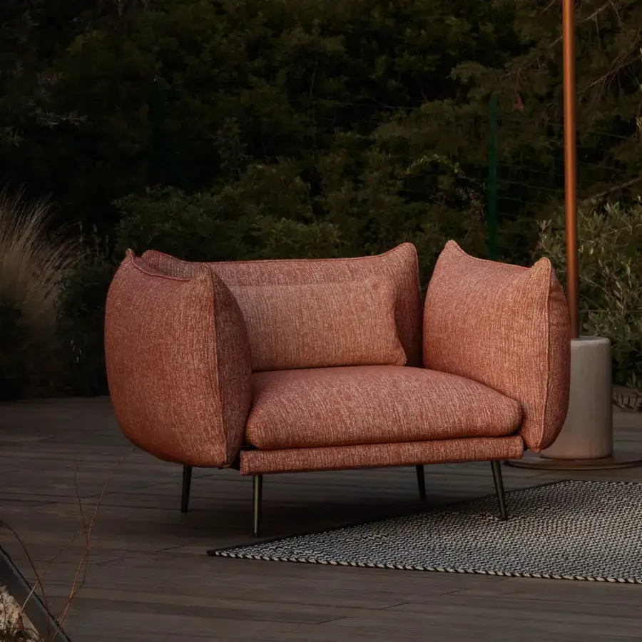 Distinguished MY YOUR Piuma lounge chair with terracotta outdoor fabric upholstery and a matte finish built with lightweight aluminum