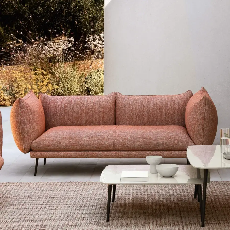 Distinguished MY YOUR Piuma sofa with rounded form and reddish-brown textile upholstery, built with a durable aluminum frame for outdoor use