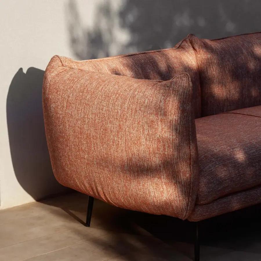 Remarkable MY YOUR Piuma sofa built with lightweight aluminum, showcasing textured reddish-brown outdoor fabric with subtle peach highlights and matte finish