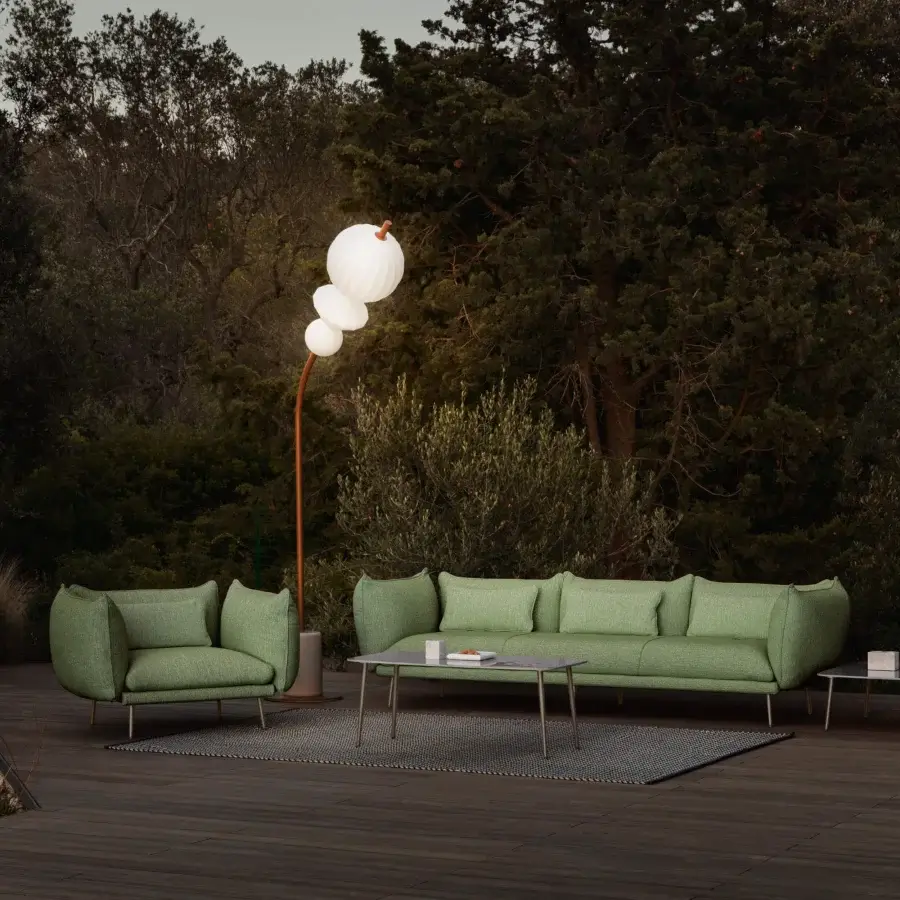 Distinguished Lanzavecchia Wai Piuma sofa with muted green outdoor fabric upholstery and delicate textured stitching