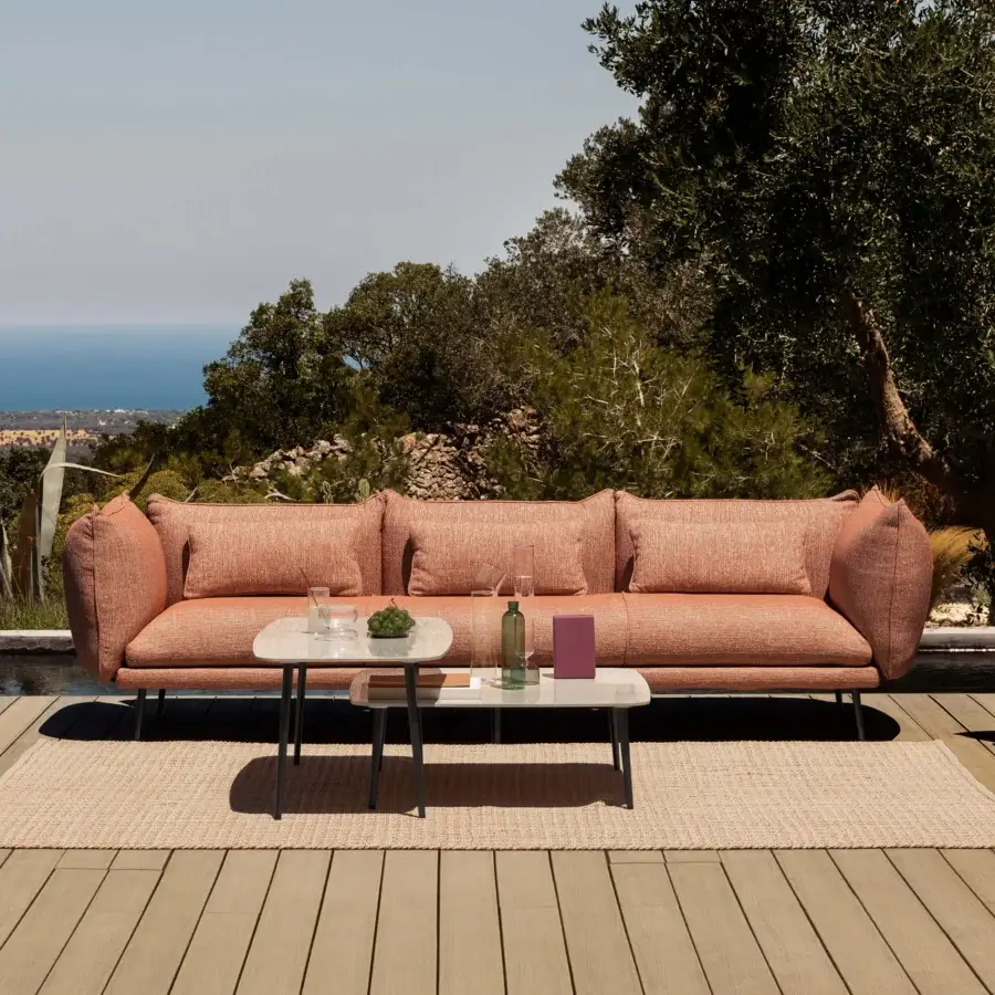 Distinguished MY YOUR Piuma sofa with a minimal aluminum structure and muted coral outdoor fabric upholstery with highlighted stitching and matte finish