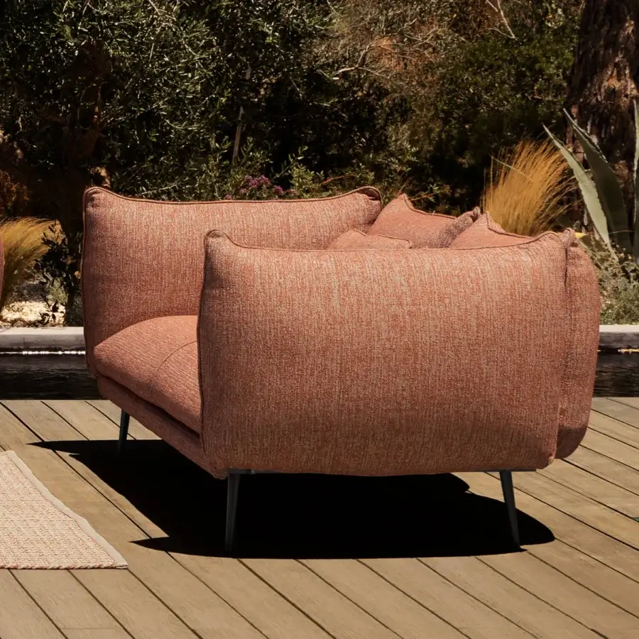Exceptional MY YOUR Piuma sofa with softly sculpted form upholstered in textured terracotta outdoor fabric and a matte finish