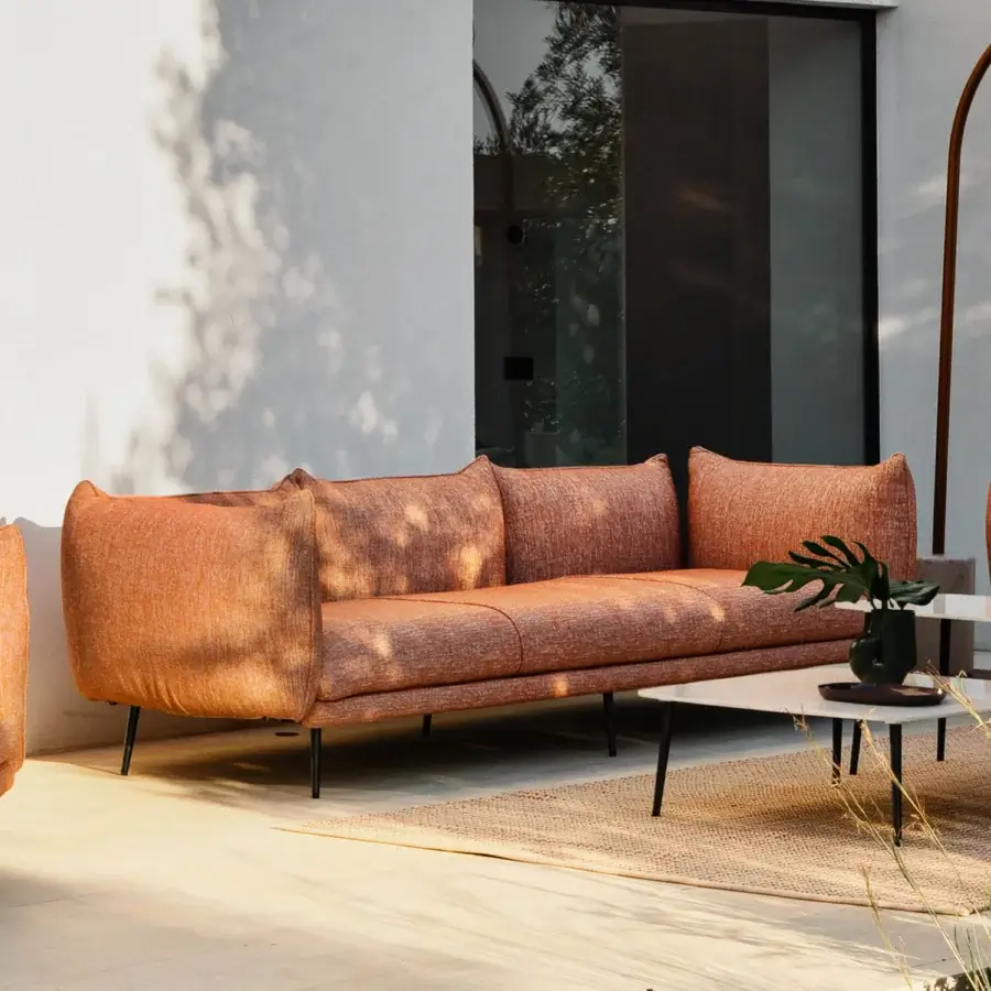 Superior Lanzavecchia Wai Piuma sofa crafted with aluminum and durable reddish-brown outdoor fabric exhibiting highlighted stitching and subtle texture