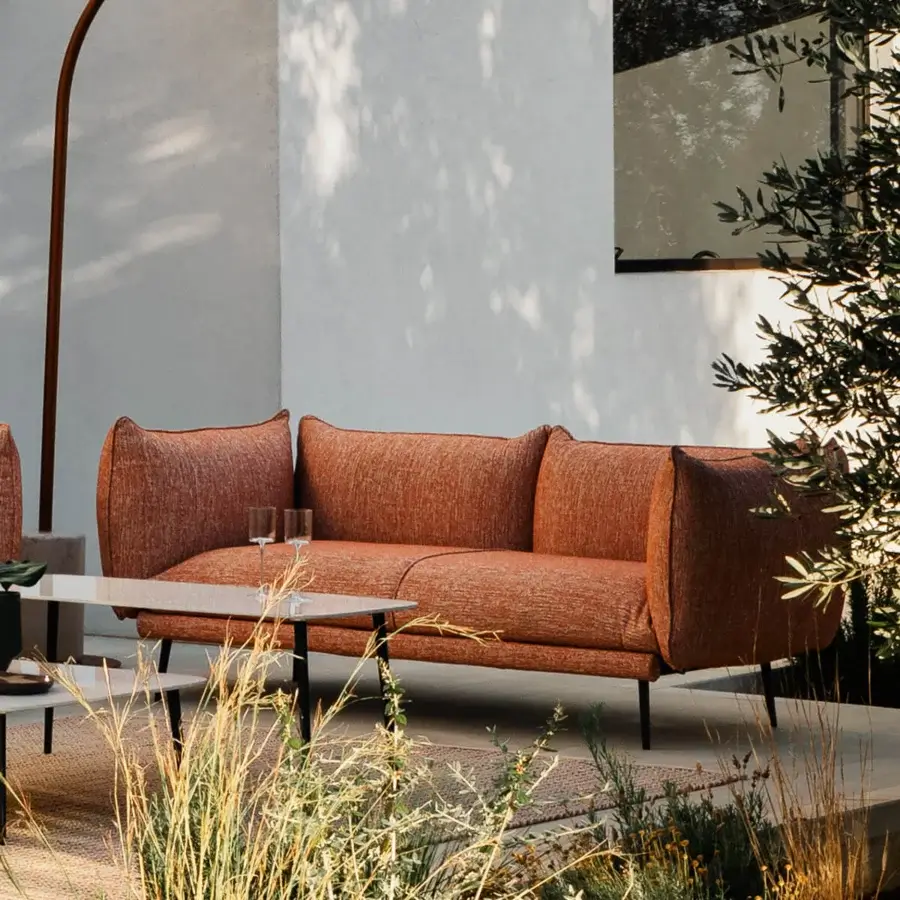 Distinguished MY YOUR Piuma sofa with reddish-brown outdoor fabric and lightweight aluminum structure crafted for lasting durability