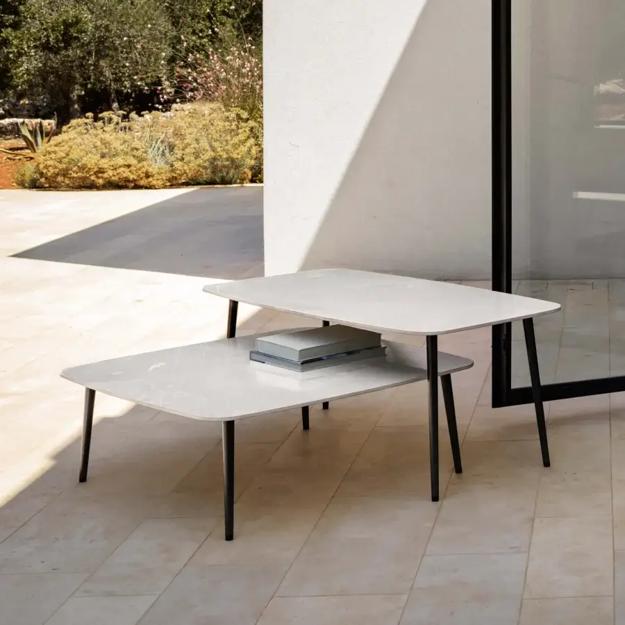 Superior MY YOUR Piuma coffee table set with light gray-white marble and matte black metal legs crafted in aluminum with outdoor fabric