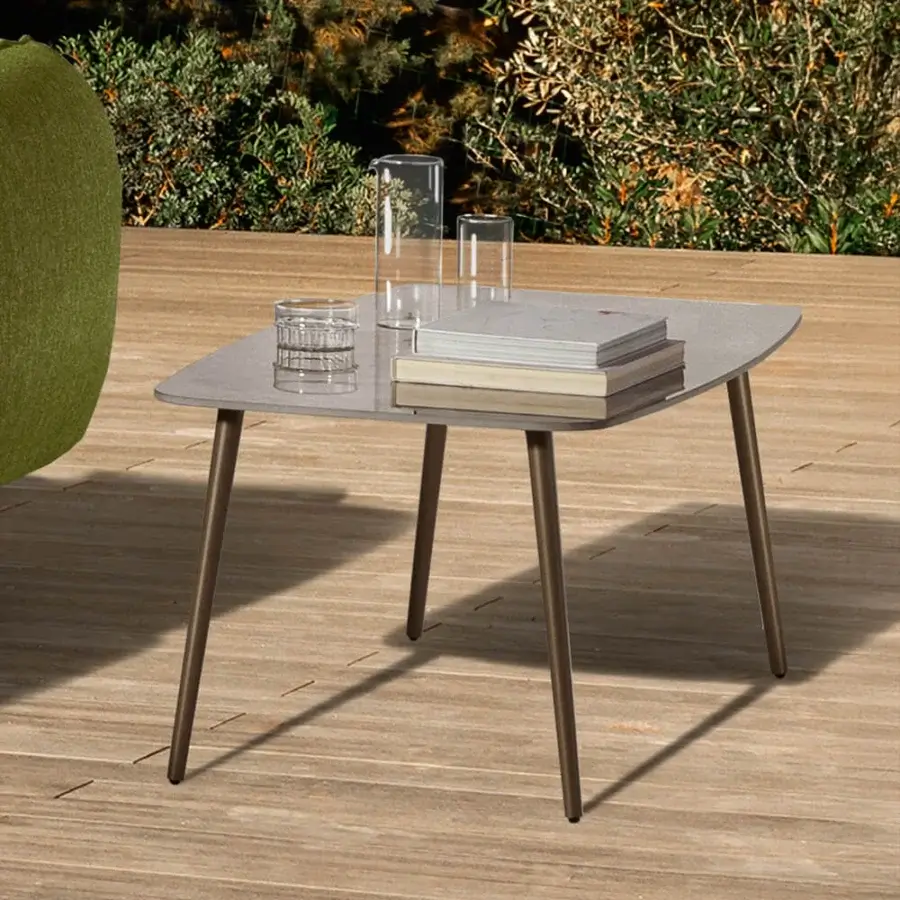 Sophisticated MY YOUR Piuma coffee table in muted grey with a satin glass tabletop and bronze-toned aluminum base