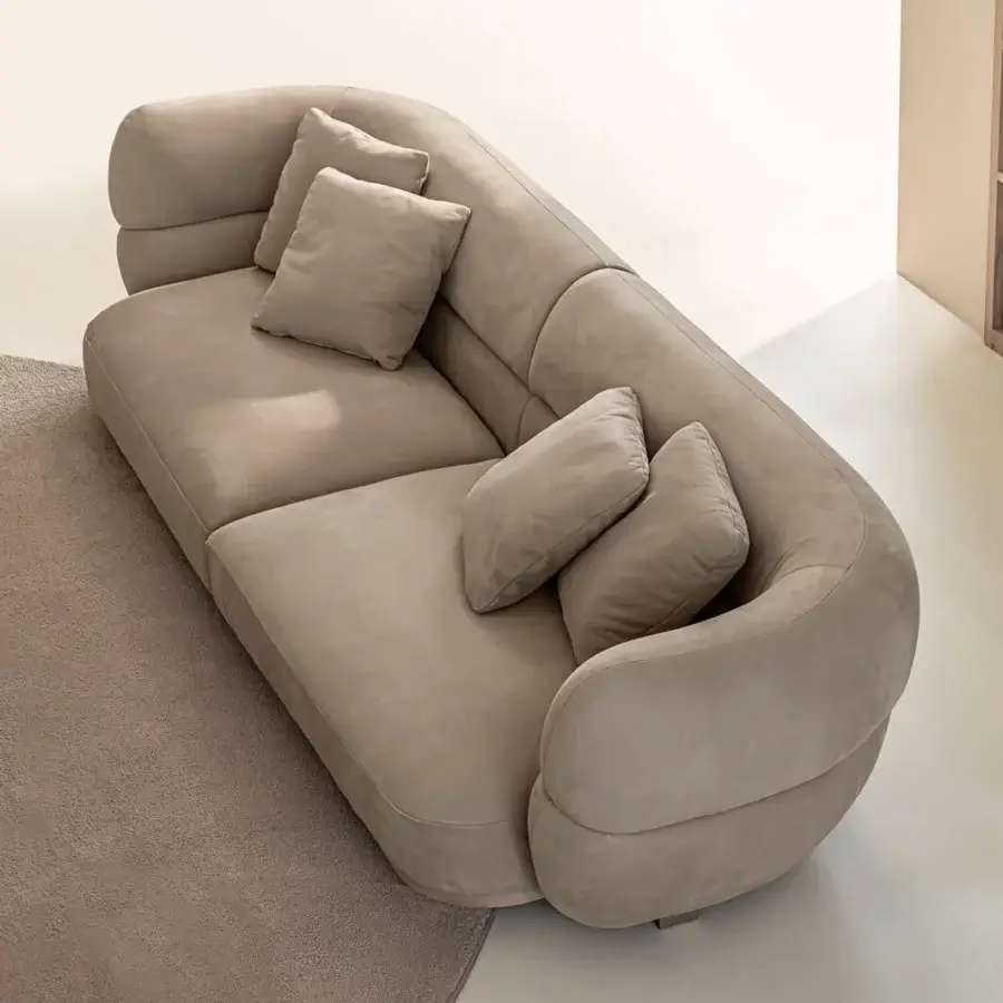 Exceptional Shake Vogue sofa with organically curved form upholstered in matte beige textile and varnished steel legs