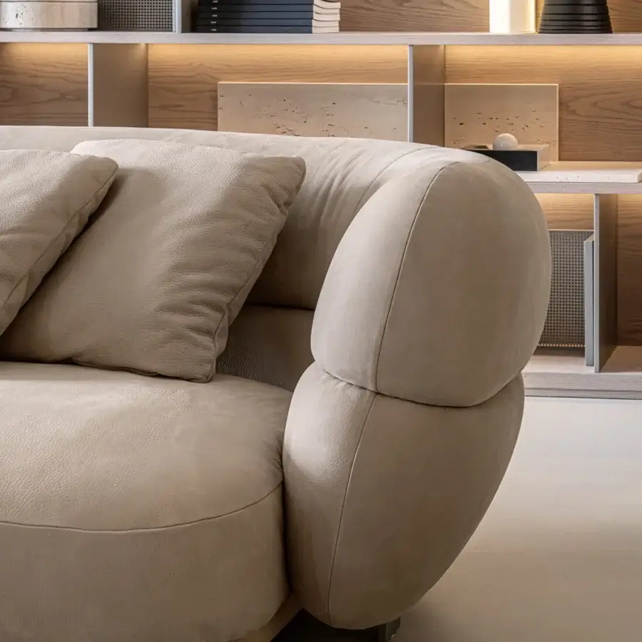 Lavish Shake Vogue sofa with inviting curved form upholstered in matte neutral beige textile and varnished steel feet