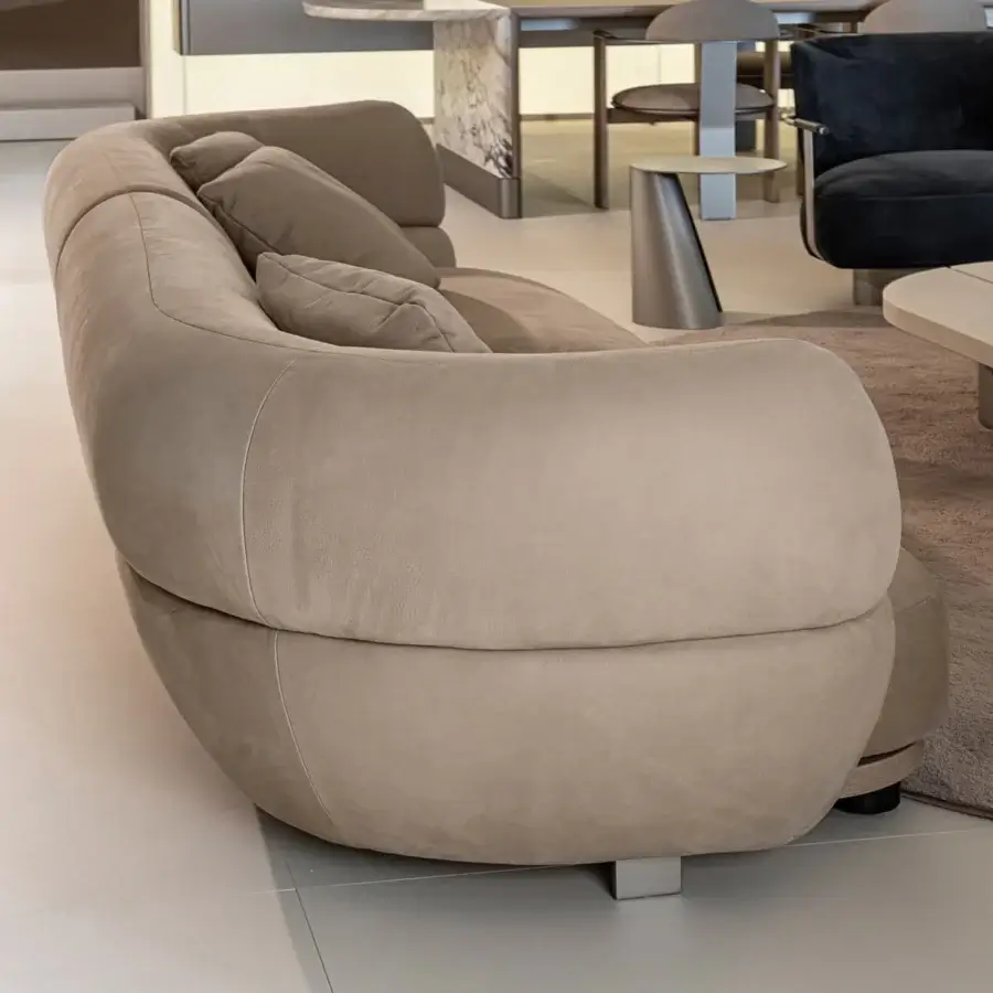 Distinguished Shake Vogue sofa with low organic form upholstered in soft matte beige textile and varnished steel feet