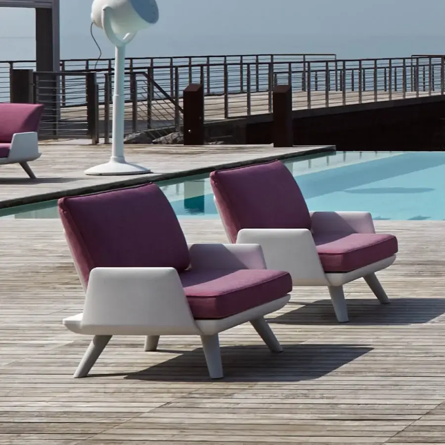 Elegant MY YOUR Samurai lounge chair with a matte off-white frame and deep plum cushions built for outdoor use with water-repellent fabrics