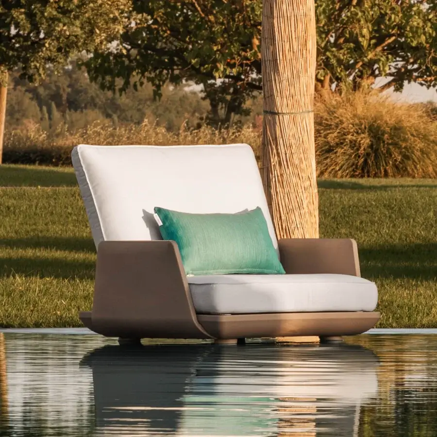 Distinguished MY YOUR Samurai lounge chair with a matte frame and water-repellent light beige fabric accented by teal cushions