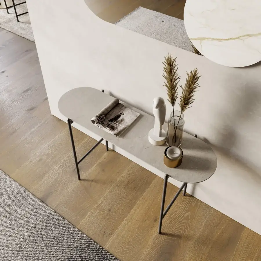 Distinguished Dallagnese Juno mirror with a light gray curved frame and distinctive circular stoneware insert