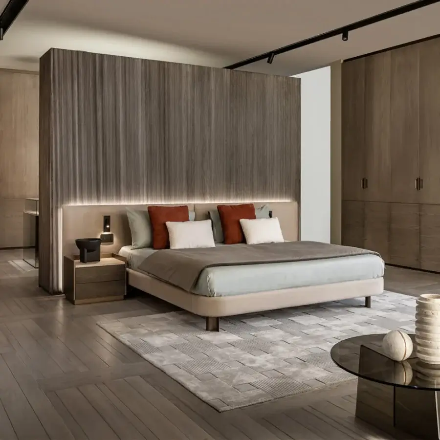 Distinguished Shake Line bed with muted beige-grey textile upholstery and slim varnished steel legs crafted in Italy