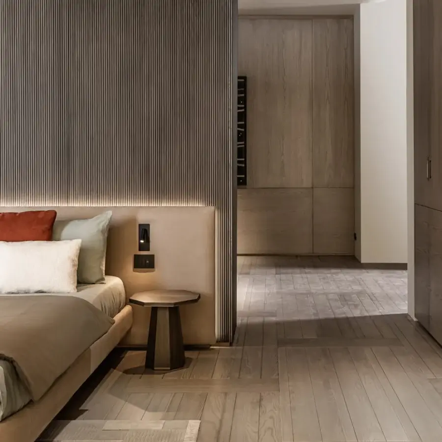 Superior Shake Line bed with textured vertical wood slats and fully upholstered warm beige fabric frame with varnished steel legs