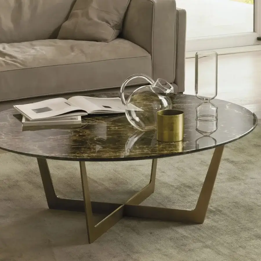 Distinguished CTS Salotti Charme coffee table with dark green marble top and curved brass-toned metal base crafted with glossy gold veining