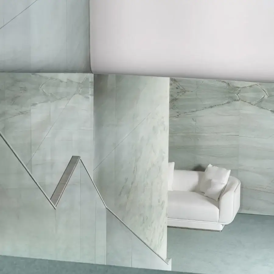 Superior Visionnaire Foster sofa with white textile upholstery, canneté quilting and a metal-clad plinth base