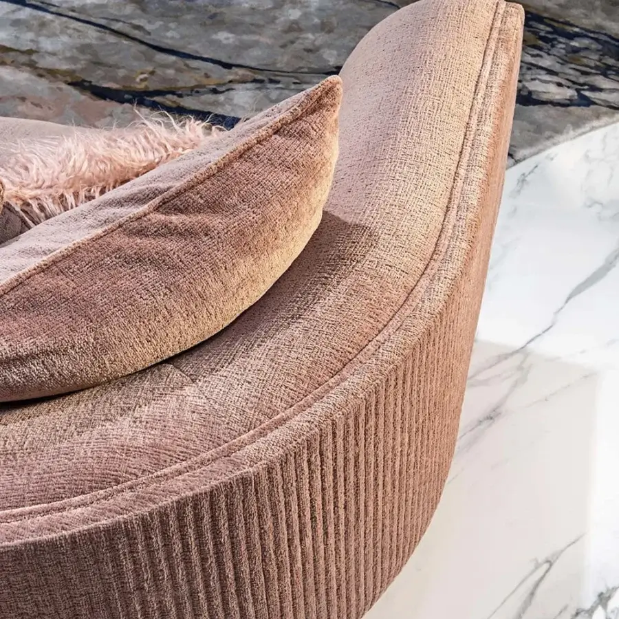 Elegant Visionnaire Foster sofa with rose-toned fabric upholstery, vertical canneté quilting and sleek metal-clad base