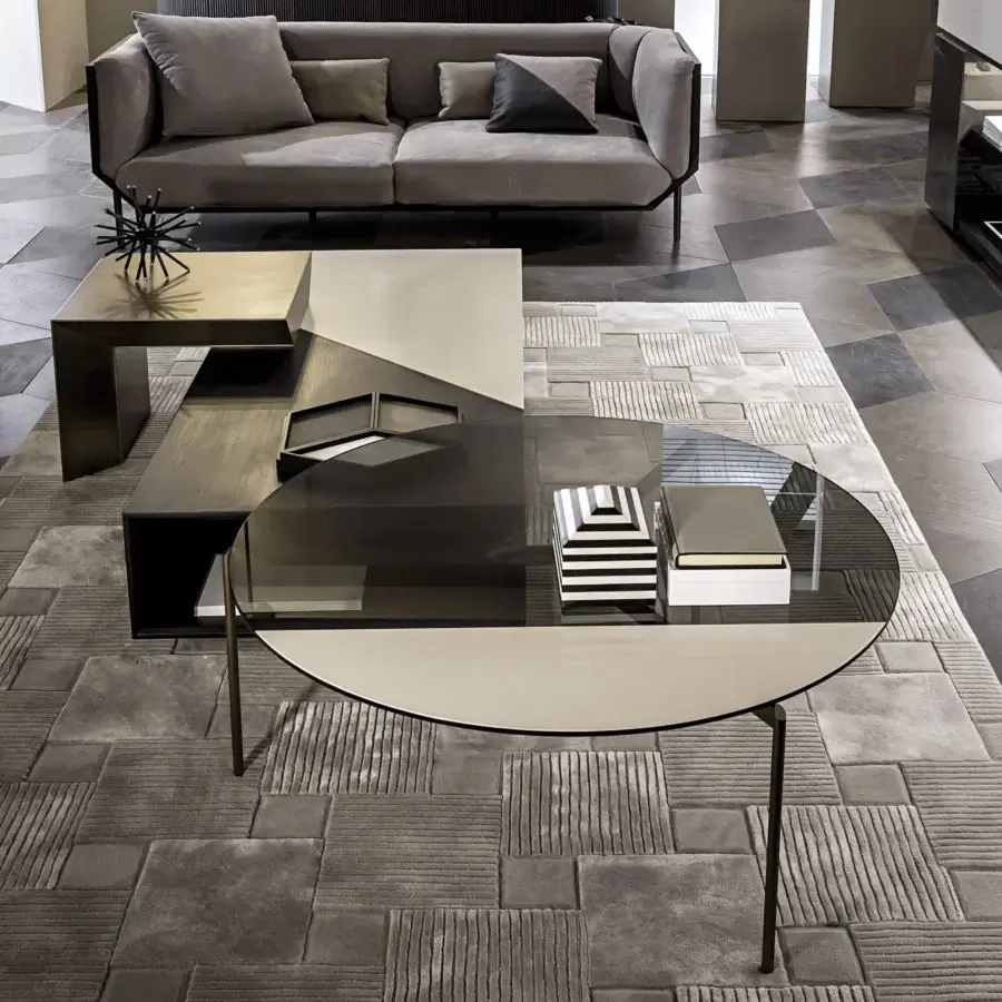 Elegant Shake Lily coffee table crafted with varnished steel, a transparent tempered glass top and a refined lacquered band
