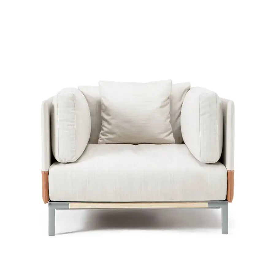 Superior Ethimo Baia lounge chair with light-colored wood frame and soft textured beige fabric upholstery