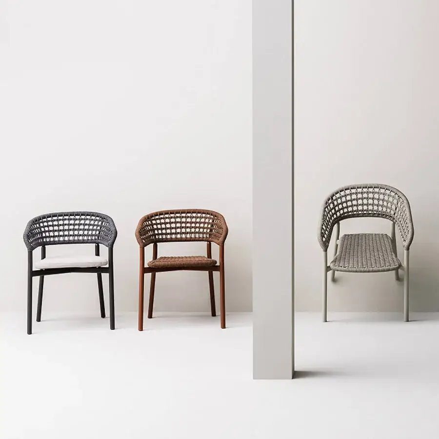 Elegant Varaschin Plinto dining armchair with dark gray woven seat and nearly black wood-tone aluminum frame crafted with a textured finish