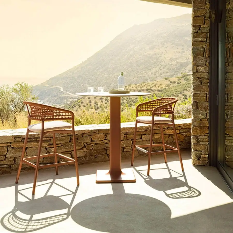 Distinguished Varaschin Plinto bar stool with reddish-brown powder-coated aluminum and light beige woven textile seat